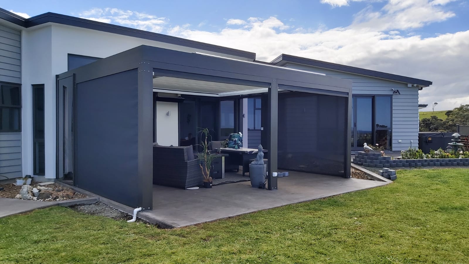 Patio side covers in Auckland home create outdoor shade