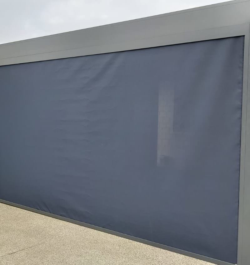 A patio cover transforms an open backyard into a private outdoor space